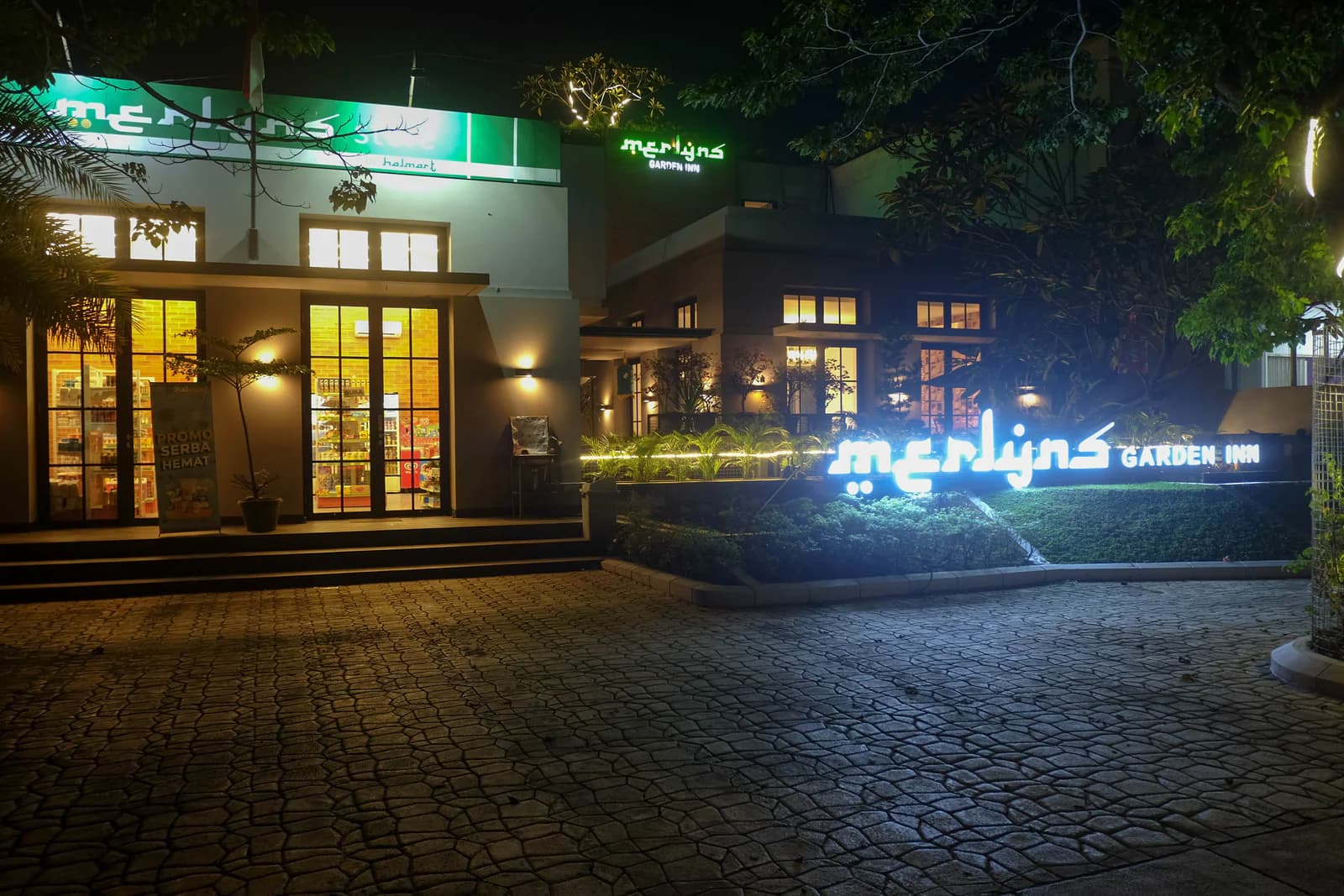 Merlyns Garden Inn illuminated at night